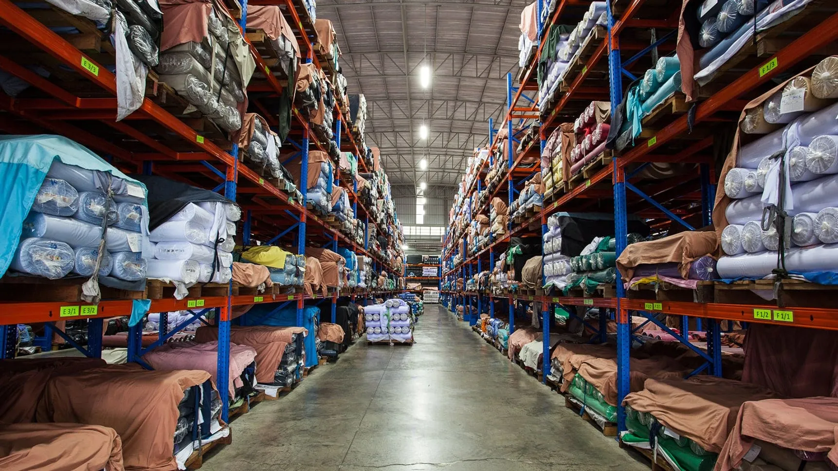 Warehouse of dyed fabric rolls